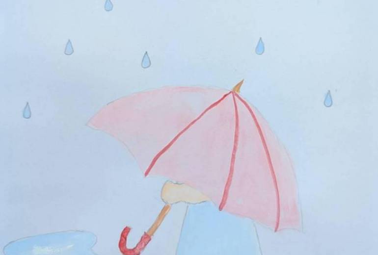 雨の中たたずむ女の子