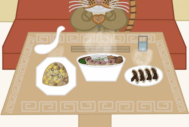 猫がレストランで食事をしている所