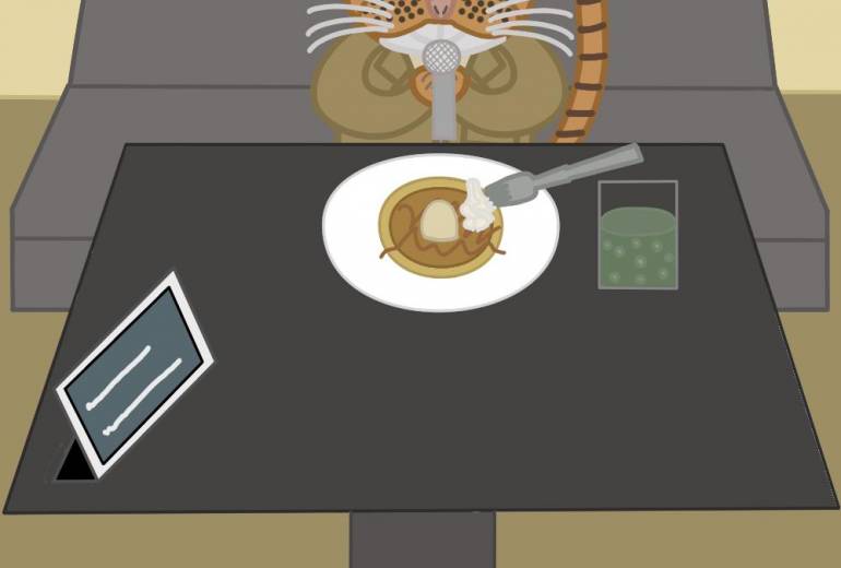 猫がカラオケで歌を歌っている所